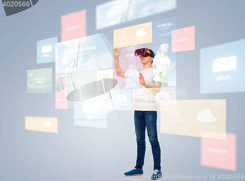 Image of happy man in virtual reality headset or 3d glasses