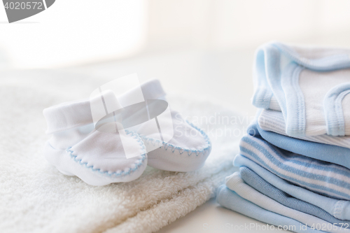 Image of close up of baby boys clothes for newborn on table