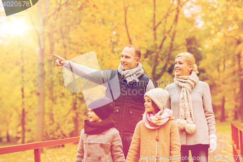 Image of happy family in autumn park