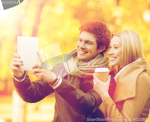 Image of couple taking photo picture autumn park