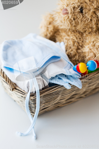 Image of close up of baby clothes and toys for newborn