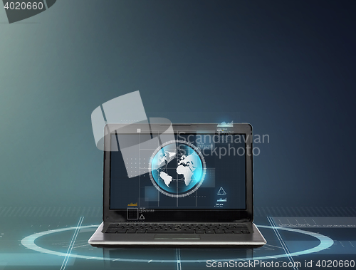 Image of laptop computer with earth globe on screen