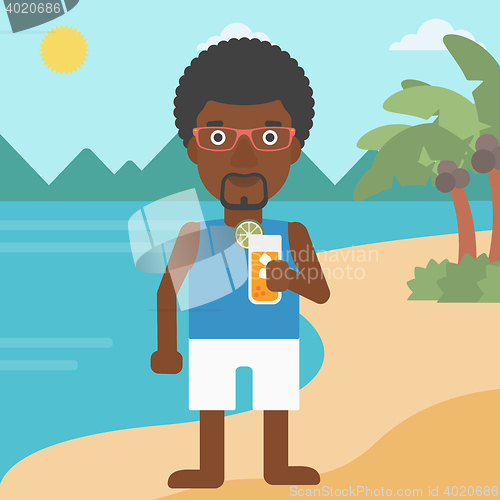 Image of Man with cocktail on the beach.