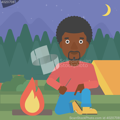Image of Man kindling campfire vector illustration.