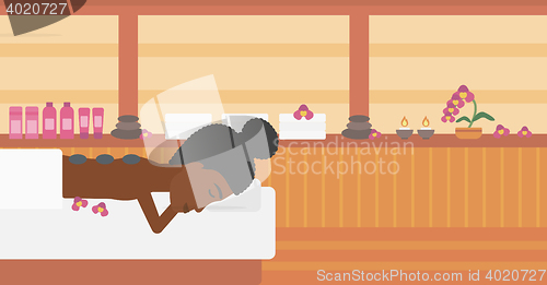 Image of Woman getting stone therapy vector illustration.