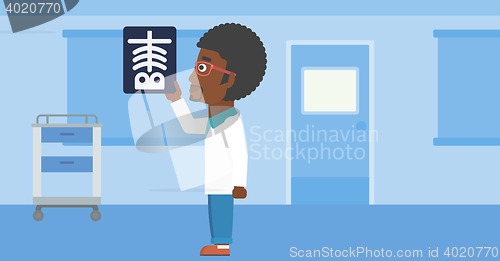 Image of Doctor examining radiograph.