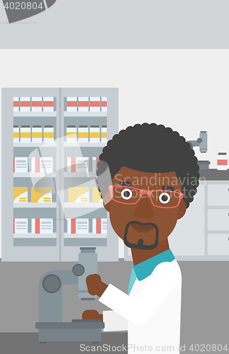 Image of Laboratory assistant with microscope.