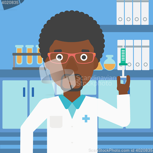 Image of Laboratory assistant with syringe in lab.