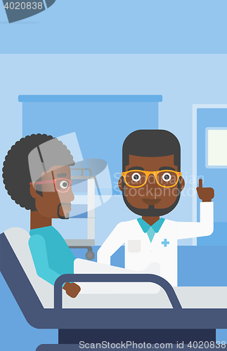 Image of Doctor visiting patient.