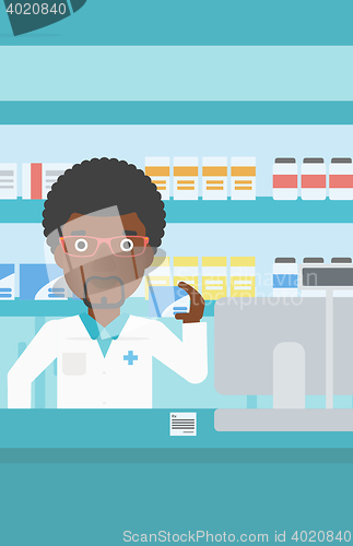 Image of Pharmacist showing some medicine.