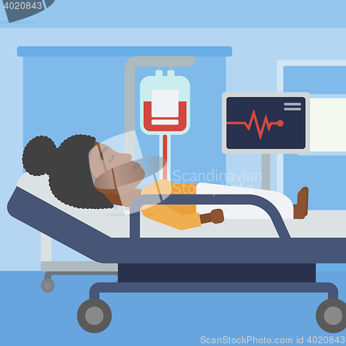 Image of Woman lying in hospital bed.