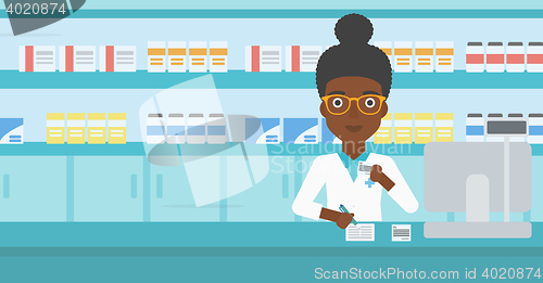 Image of Pharmacist writing prescription.