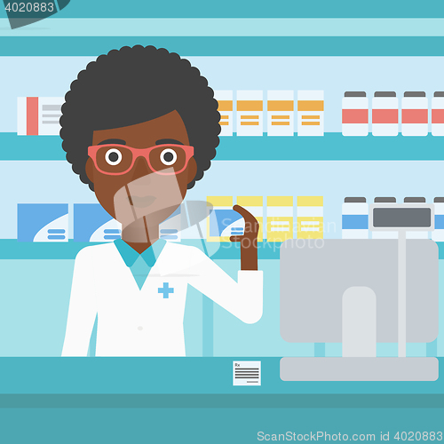 Image of Pharmacist showing some medicine.