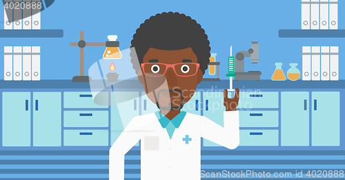 Image of Laboratory assistant with syringe in lab.