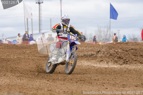 Image of Volgograd, Russia - April 19, 2015: Motorcycle racer riding on dirt track, at the stage of the Open Championship Motorcycle Cross Country Cup Volgograd Region Governor