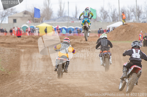 Image of Volgograd, Russia - April 19, 2015: A few riders in pursuit of the leader, at the stage of the Open Championship Motorcycle Cross Country Cup Volgograd Region Governor