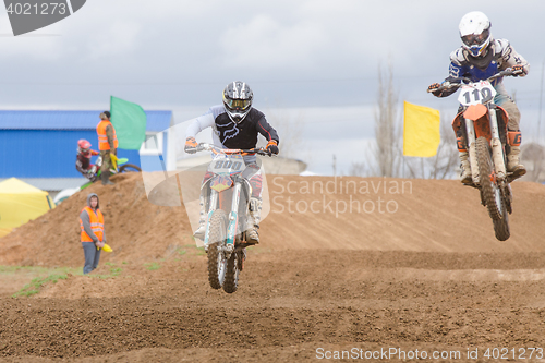 Image of Volgograd, Russia - April 19, 2015: Two riders on the track, at the stage of the Open Championship Motorcycle Cross Country Cup Volgograd Region Governor