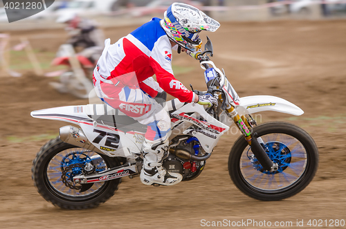 Image of Volgograd, Russia - April 19, 2015: Motorcycle racer racing on dirt track, at the stage of the Open Championship Motorcycle Cross Country Cup Volgograd Region Governor