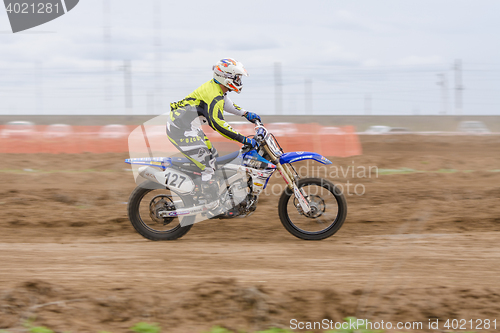 Image of Volgograd, Russia - April 19, 2015: Motorcycle racer racing on dirt track, at the stage of the Open Championship Motorcycle Cross Country Cup Volgograd Region Governor