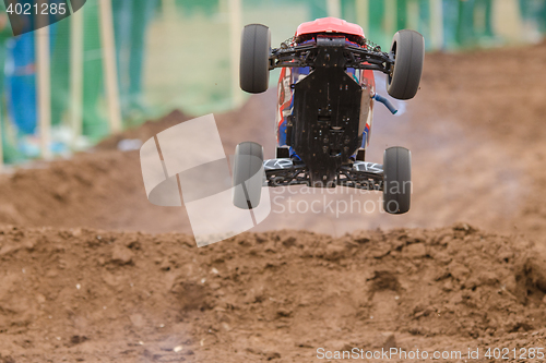 Image of Volgograd, Russia - April 19, 2015: Radio-controlled machine with a combustion engine has jumped on the trampoline