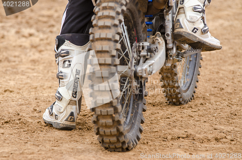 Image of Volgograd, Russia - April 19, 2015: Rear wheel motorcycle on which sits a motorcycle racer, at the stage of the Open Championship Motorcycle Cross Country Cup Volgograd Region Governor