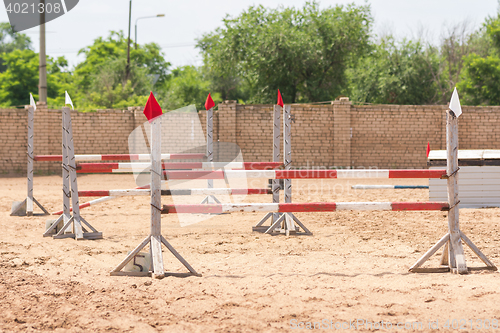 Image of Barriers to stage equestrian competitions in show jumping style