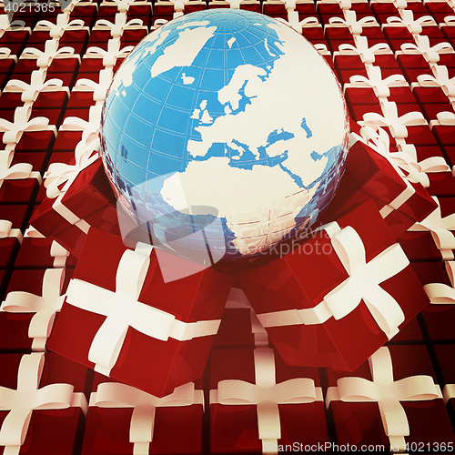 Image of Traditional Christmas gifts and earth. Global holiday concept . 