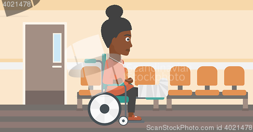 Image of Woman with broken leg sitting in wheelchair.