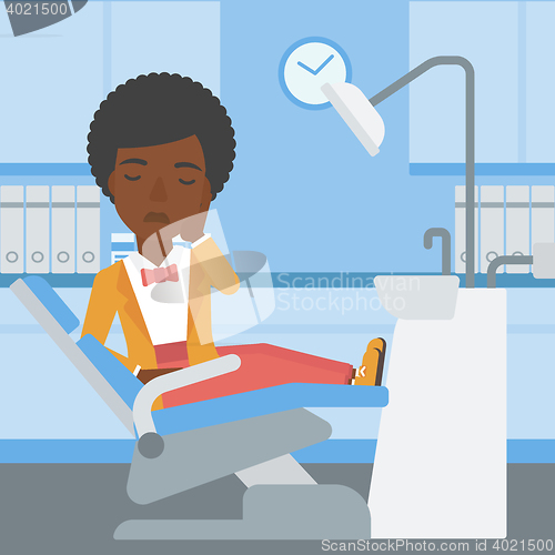Image of Woman suffering in dental chair.
