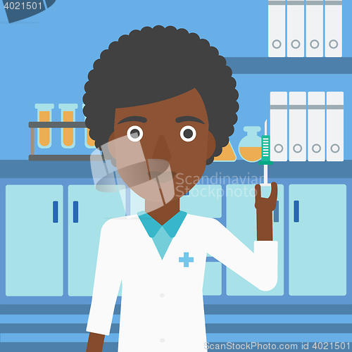 Image of Laboratory assistant with syringe in lab.