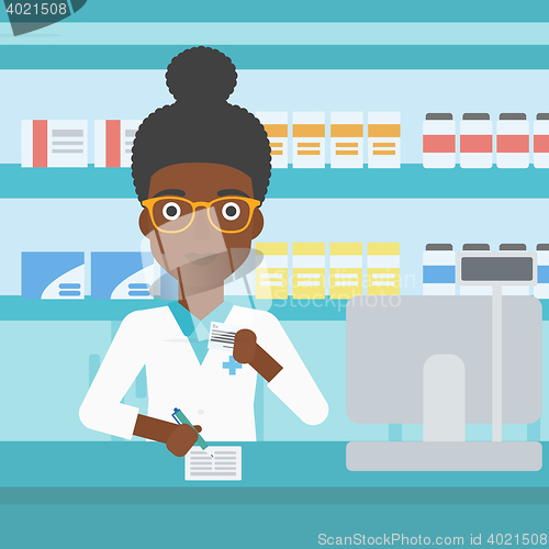 Image of Pharmacist writing prescription.