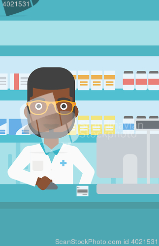 Image of Pharmacist at counter with cash box.