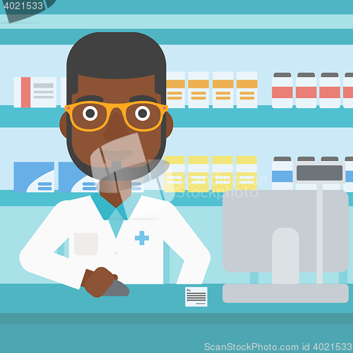 Image of Pharmacist at counter with cash box.