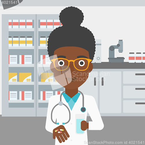 Image of Pharmacist giving pills and glass of water.