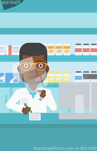 Image of Pharmacist writing prescription.
