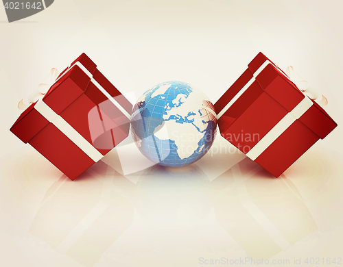 Image of Traditional Christmas gifts and earth. Global holiday concept . 