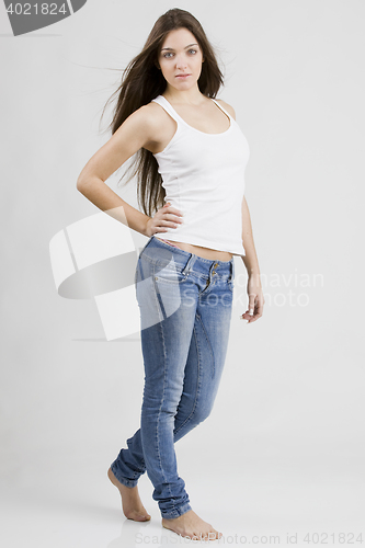 Image of stylish young woman posing in clear background