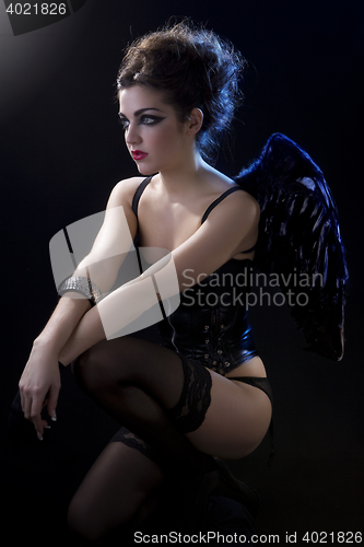 Image of female dark angel with black wings in lingerie