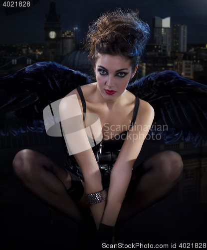 Image of female dark angel with black wings in lingerie