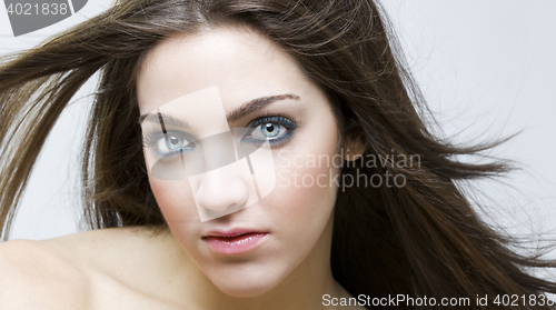 Image of stylish young woman posing in clear background