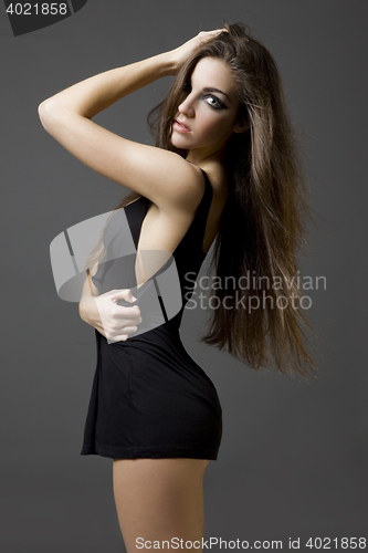 Image of stylish young woman posing in clear background