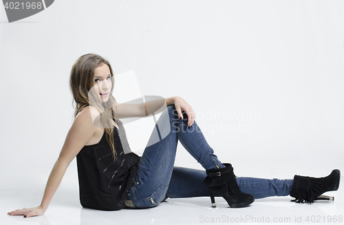 Image of stylish young woman posing in clear background