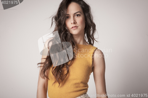 Image of stylish young woman posing in clear background