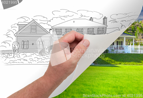 Image of Hand Turning Page of Custom Home Drawing To Photograph