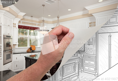 Image of Hand Turning Page of Custom Kitchen Photograph to Drawing