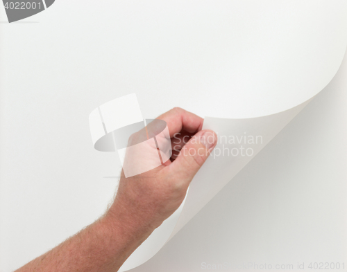 Image of Hand Turning Blank Page with Clipping Paths