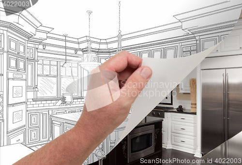 Image of Hand Turning Page of Custom Kitchen Drawing to Photograph