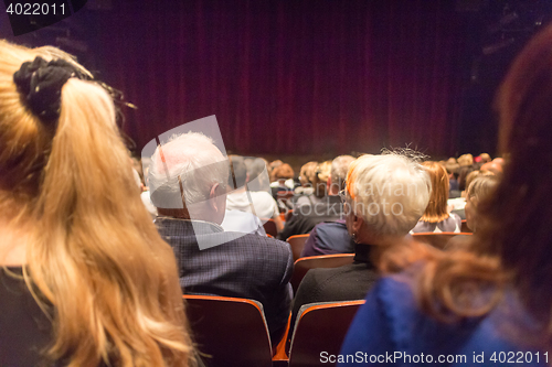 Image of Audience in theathre waiting for drama play to start.