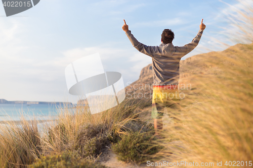 Image of Free active man enjoying beauty of nature.