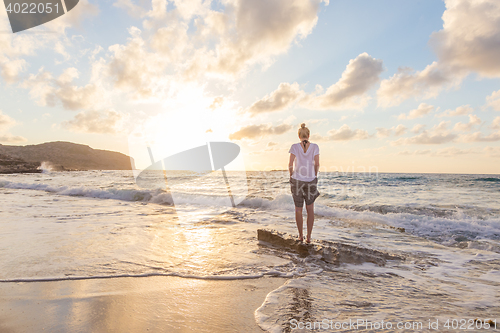 Image of Free Happy Woman Enjoying Sunset on Sandy Beach